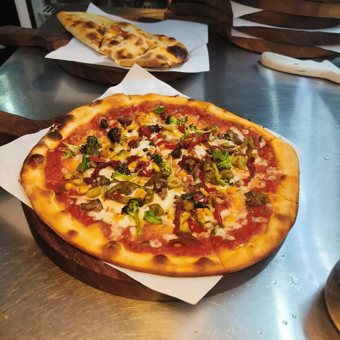 Custom Italian pizza with fresh vegetable toppings