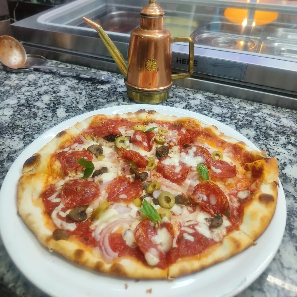 Artisan Italian pizza at Roy's Pizzeria Karkhana